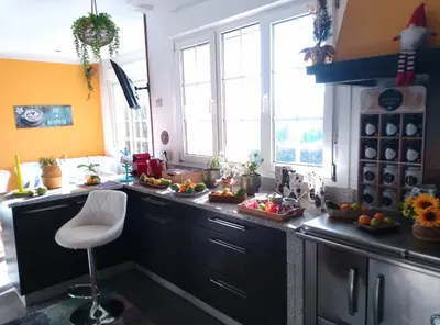 a bathroom with a sink and two windows with orange curtains at Casa Quercus Galicia a 17 minutos de Compostela! in A Estrada