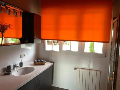 a bedroom with a bed with a blanket and a picture at Casa Quercus Galicia a 17 minutos de Compostela! in A Estrada