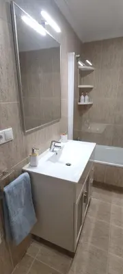 a bathroom with a sink and a tub and a mirror at Mariña in Viveiro