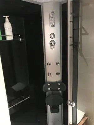 a close up of a shower door with buttons on it at Costa SPA Ático de lujo - Playa de las Catedrales in San Miguel de Reinante