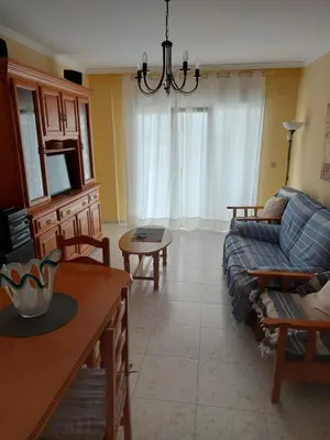 a living room with a couch and a table at Vivienda PLAYA DE ALTAR in Barreiros