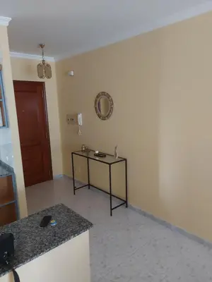 a room with a table and a mirror on the wall at Vivienda PLAYA DE ALTAR in Barreiros