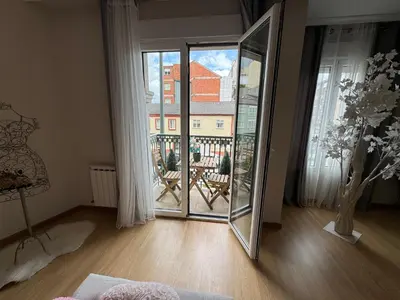 a room with a mirror and a large window at Maison Liberdade By Oktheway in Sarria