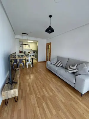 a living room with a couch and a table at Atalaia Apartment Foz in Foz