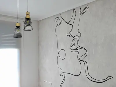a drawing of a woman on a wall with two lights at Atalaia Apartment Foz in Foz