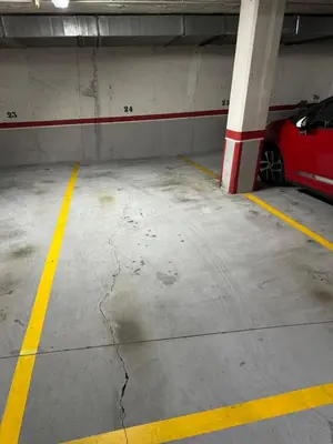 a parking garage with a red car parked in it at O Faiado Da Ria By Oktheway in Culleredo
