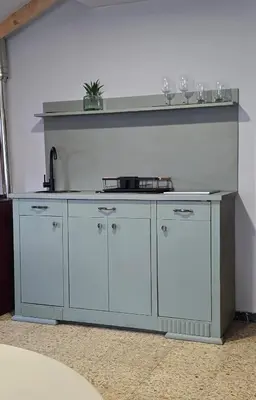 a blue kitchen counter with a sink in a room at Apartamento Riazón3 in Ourense