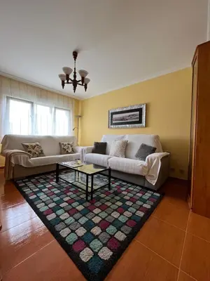 a living room with a couch and a coffee table at O Carballal in A Pontenova