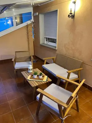 a room with chairs and tables and a window at Tres Ruas in A Pontenova