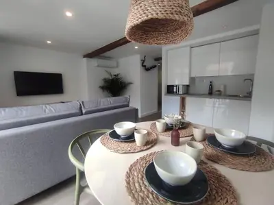 a living room with a table and a couch at Lepanto 4 - Precioso y súper luminoso dúplex con vistas in Ourense