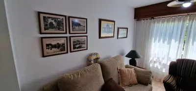a living room with a couch and pictures on the wall at El Mirador de Covas - 2 Hab - Garaje in Covas