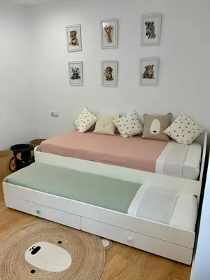 a bedroom with a bed with a bed frame at A Casa Riquiña in Lugo