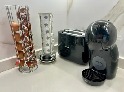 a kitchen counter with a blender and other appliances at A Casa Riquiña in Lugo