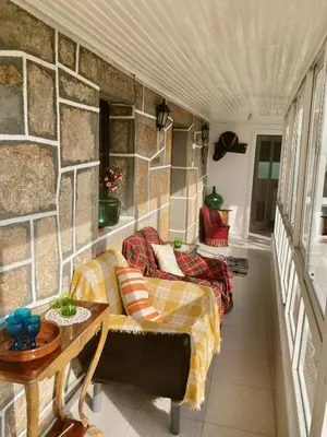 a living room with a couch and a table at Forxa, Ventosela in Ventosela