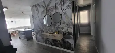 a bathroom with a sink and mirrors on a wall at Las Gaviotas in Viveiro