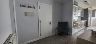 a room with a door and a chair in it at Las Gaviotas in Viveiro