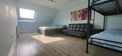 a bedroom with a bunk bed and a couch at Las Gaviotas in Viveiro