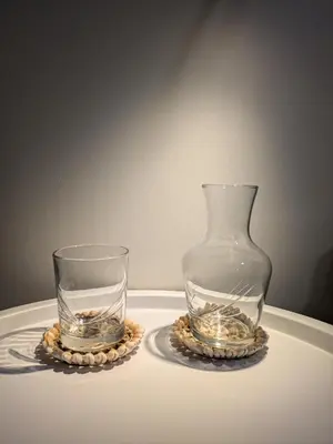 two glass vases sitting on top of a table at La Mimosa in Puentedeume