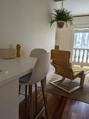 a kitchen with a dining room table and chairs at La Mimosa in Puentedeume