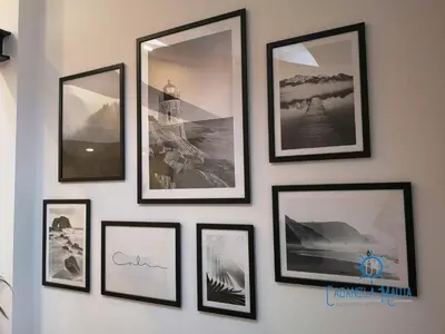 a group of pictures on a wall at Cabanela Maitia Jacuzzi privado y barbacoa in Ribadeo