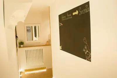 a chalkboard hanging on a wall in a room at Alojamiento YASA in Sarria