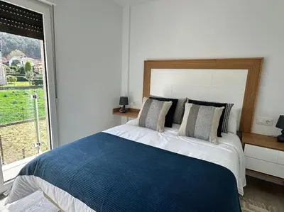 a bedroom with a large bed and a window at Casa Bela II in Sales