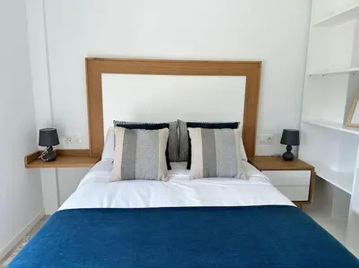 a bedroom with a large bed with blue sheets and pillows at Casa Bela II in Sales