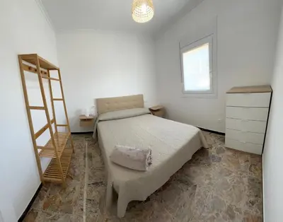 a bedroom with a bed and a ladder in it at Casa Playa de Rueta in Cervo