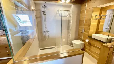 a bathroom with a shower and a toilet and a sink at The Cliffs - MarCastelos in Viveiro