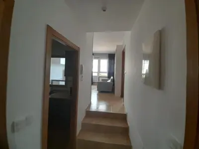 a hallway with a stairway leading to a living room at EnViveiro a pie de Playa de Covas II in Viveiro