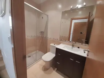a bathroom with a toilet and a sink and a shower at EnViveiro a pie de Playa de Covas II in Viveiro