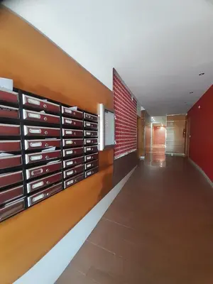 a hallway of a building with a wall of wine racks at EnViveiro a pie de Playa de Covas II in Viveiro