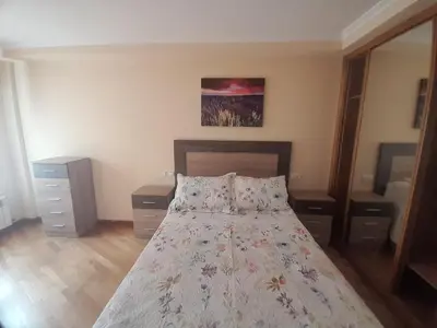 a bedroom with a bed with two pillows at EnBURELA Tus Mejores Vacaciones in Burela de Cabo