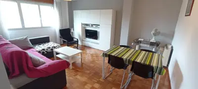 a living room with a couch and a table at EnVIVEIRO Destino Playa de Covas in Viveiro