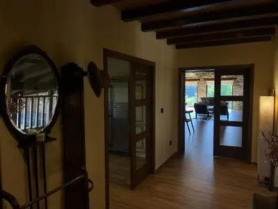 a room with a mirror and a hallway at Casa Ramona en Ribeira Sacra in Lugo