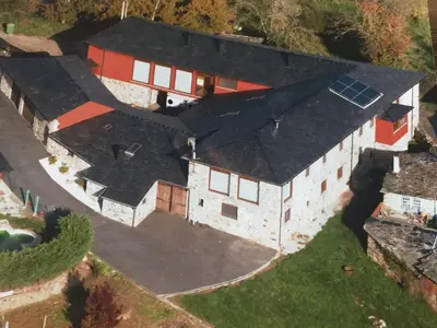 an aerial view of a house with a solar roof at Casa Ramona en Ribeira Sacra in Lugo