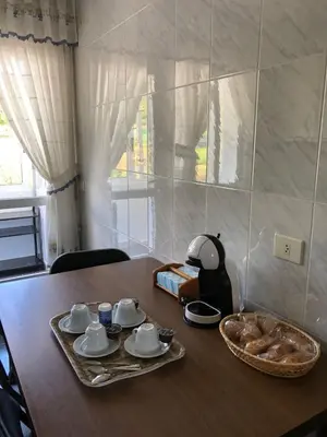 a table with a plate of food and a bowl of bread at Casa Vimar in Portomarin