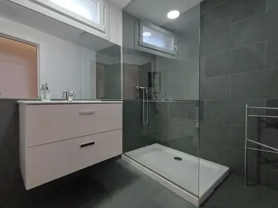 a bathroom with a shower and a sink and a glass shower at Villa Mayfa - alójate en pleno centro de Ourense in Ourense