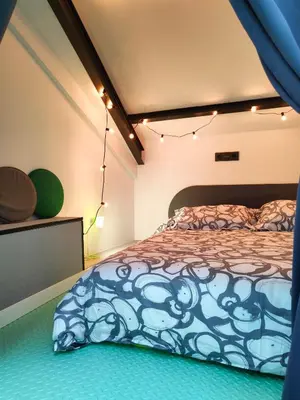 a bedroom with a bed and lights on the ceiling at VilafraggleRock, casa de diseño moderno en Pontedeume in Puentedeume