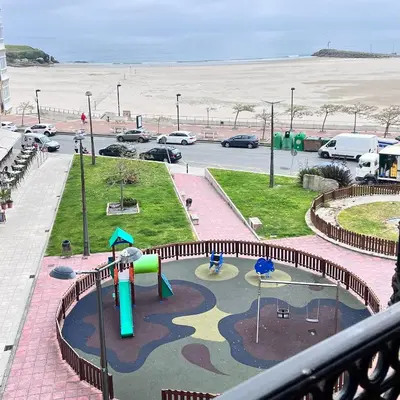 a view of a playground in a parking lot at Apartamentos Terraza playa II in Foz