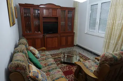 a living room with a couch and a entertainment center at Carballeira house in Lago
