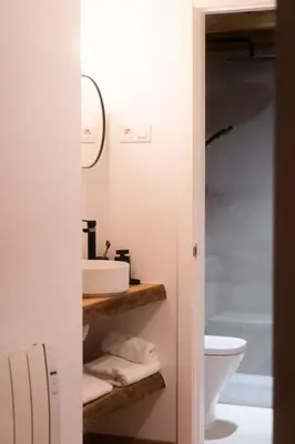 a bathroom with a sink and a toilet at A Casa Dos Ratos in Quiroga