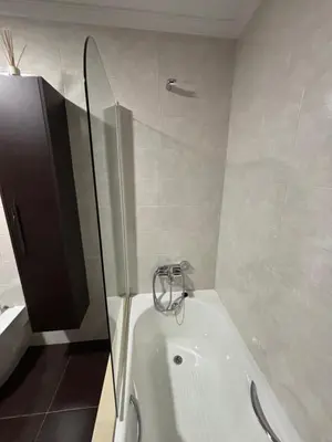 a bathroom with a shower and a bathtub with a glass door at Refuxio Xacobeo - Apartamento céntrico en Sarria in Sarria