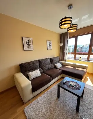 a living room with a couch and a table at Refuxio Xacobeo - Apartamento céntrico en Sarria in Sarria