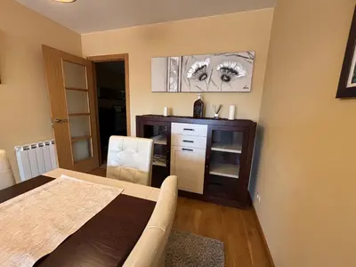 a living room with a couch and a table at Refuxio Xacobeo - Apartamento céntrico en Sarria in Sarria