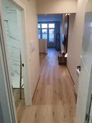 an open hallway with wooden floors in a home at Pensión CREDENCIAL in Sarria