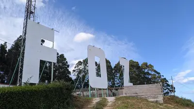 a large white sign on top of a hill at FOZLIDAYS! Apartamento, parking & relax in Foz