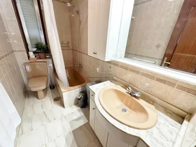 a bathroom with a sink and a tub and a toilet at O Rincón de Laly in Ourense