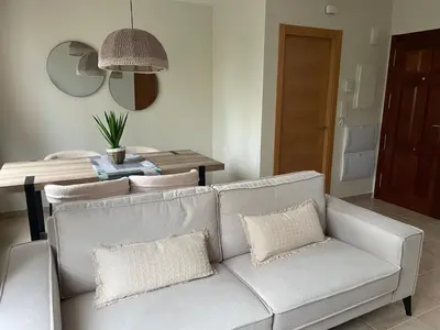 a living room with a couch and a table at El Puerto in figueras