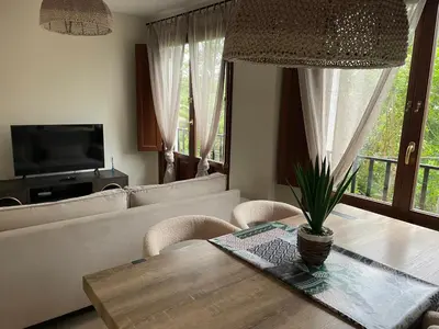 a living room with a table and a couch at El Puerto in figueras